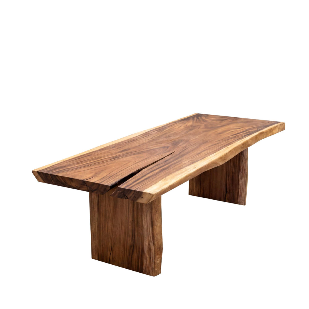 Front side view of the dining table highlighting its long solid suar wood top and bold leg structure.