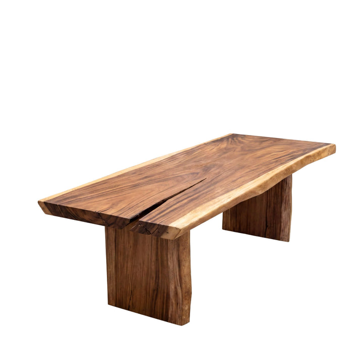 Front side view of the dining table highlighting its long solid suar wood top and bold leg structure.