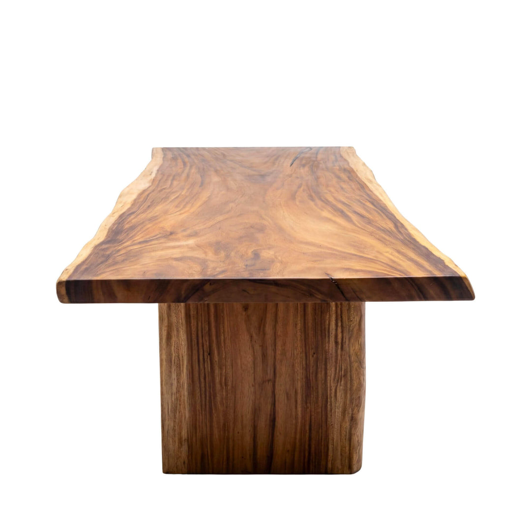 Front view of the Motu Nui dining table showing its thick tabletop and central solid wood base.