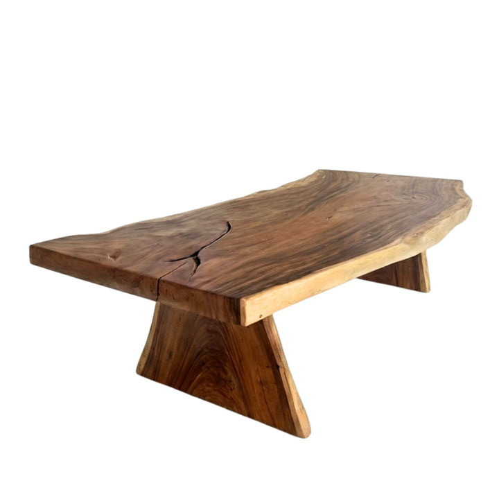Motu Nui suar wood dining table with a unique curved shaped base on a white background