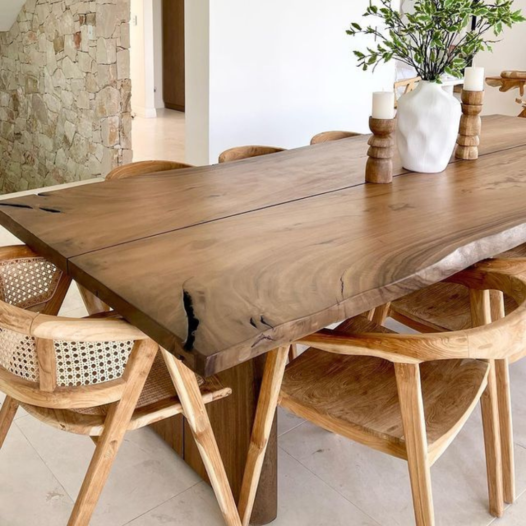 Wooden dining table with chairs in a modern interior setting