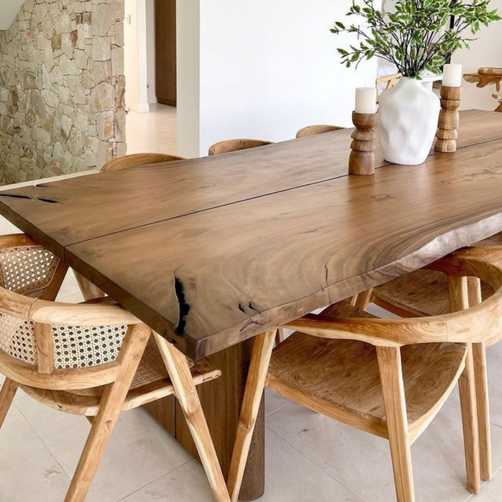 Wooden dining table with chairs in a modern interior setting