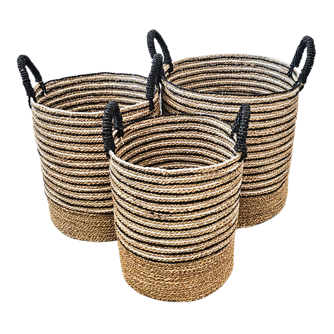 Set of three Mughsayl Seagrass Baskets with natural and black stripes.