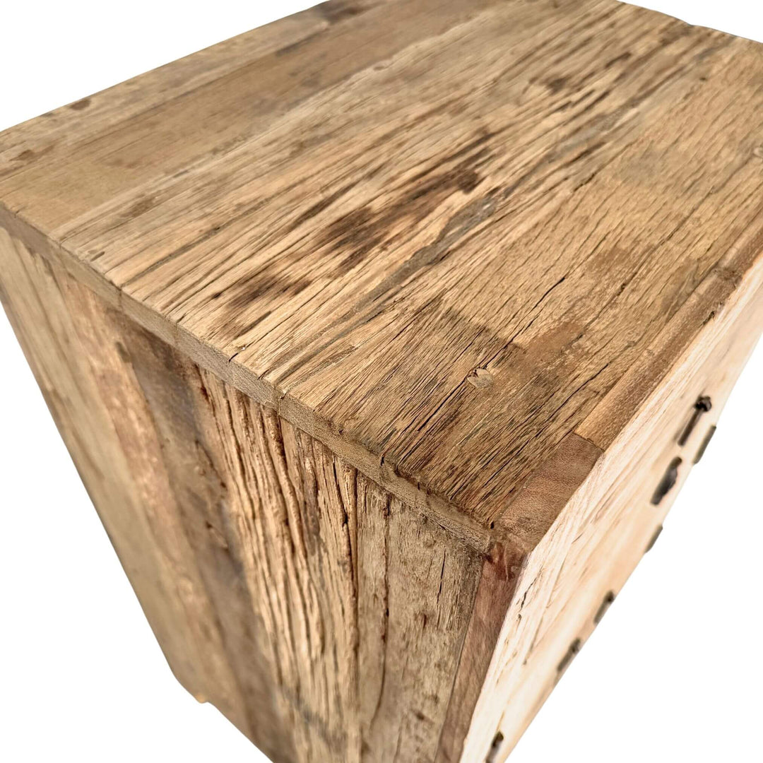 “Wooden nightstand with storage, crafted from reclaimed materials.”