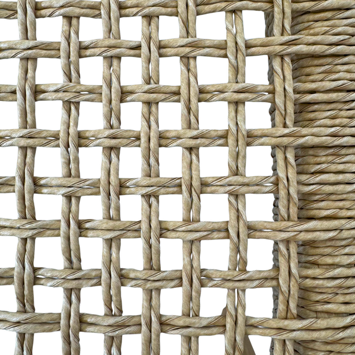 Close-up of smooth natural teak finish on Mur Dining Chair.