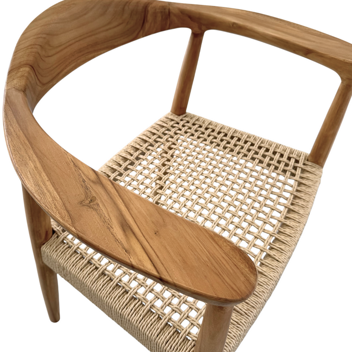 Close-up of woven synthetic rattan seat on Mur Dining Chair.