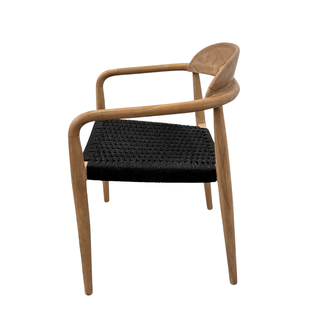 Side profile highlighting sculpted teak legs and seat depth