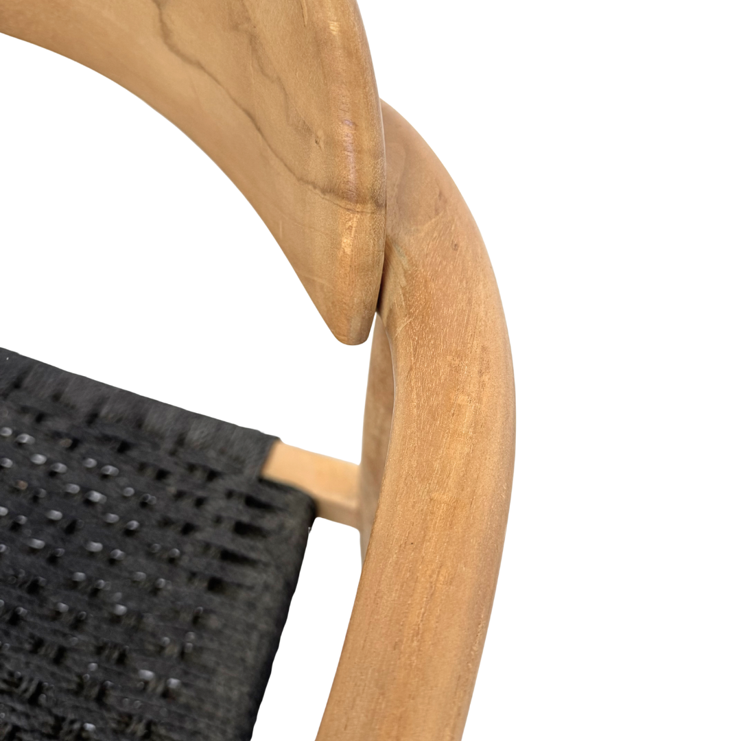 Close view of teak frame and woven seat texture of Mur Dining Chair