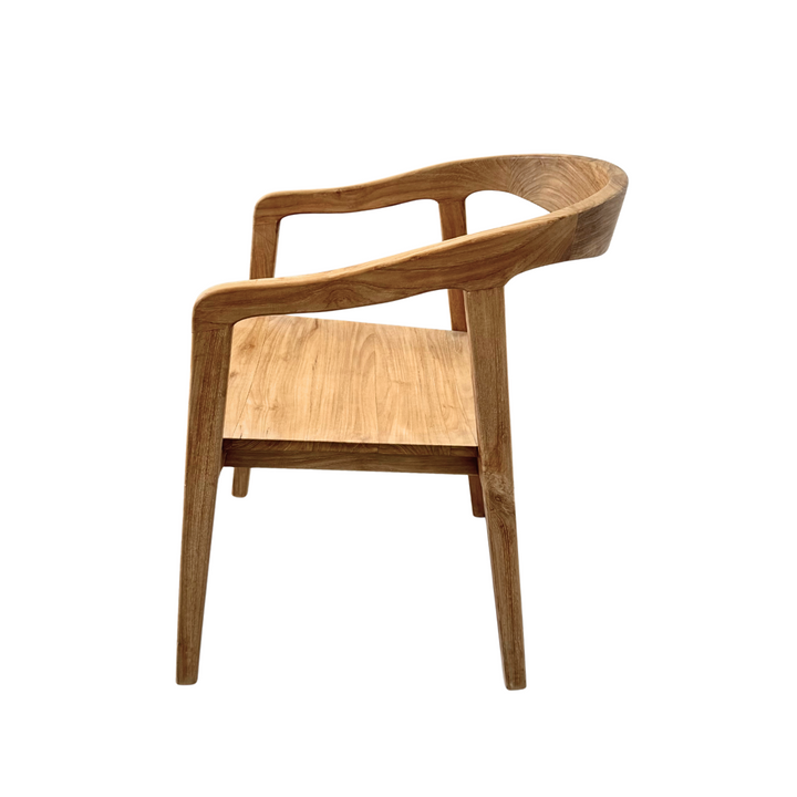 Side angle of the Mur Teak Dining Chair showing the curved backrest.