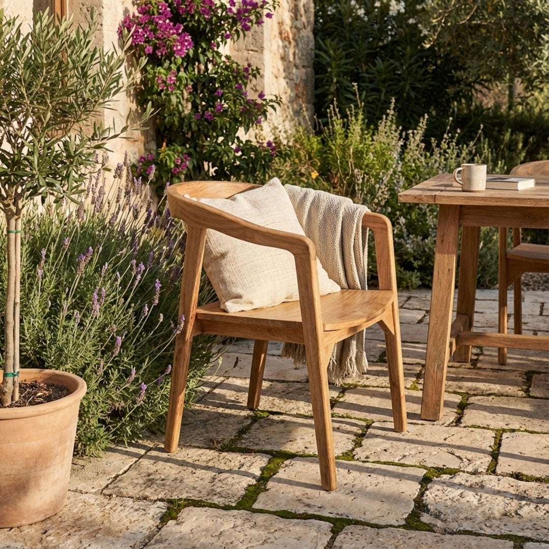 Terra setting featuring the Mur teak chair with neutral decor.