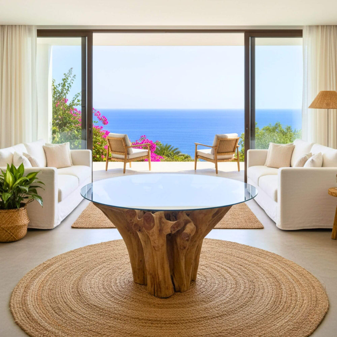 Dining table styled in coastal interior with ocean view.