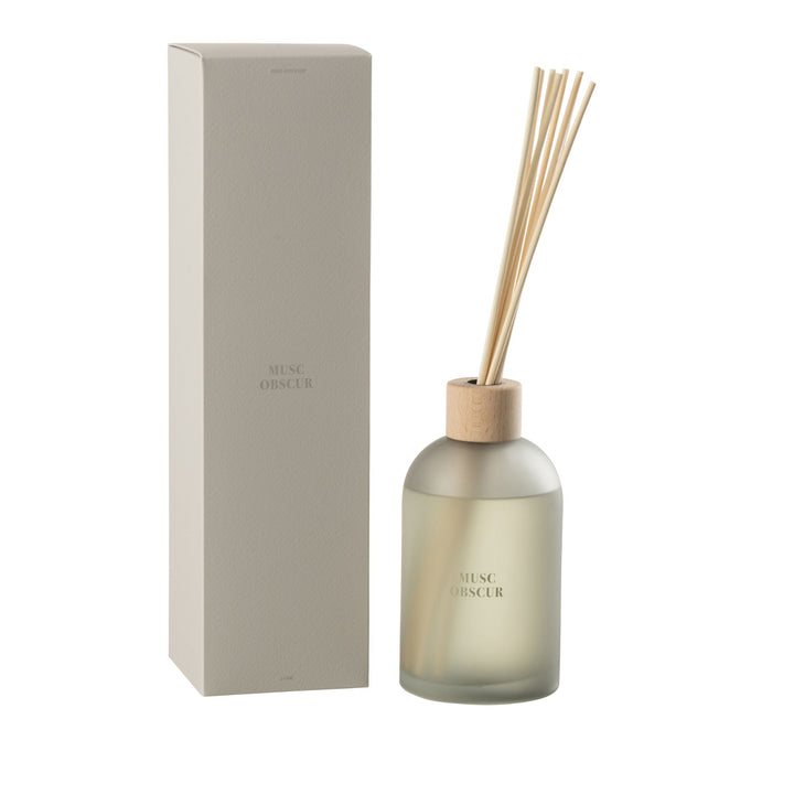 Front view of the Musc Scented Diffuser with frosted bottle, wood cap, and reeds next to its box.