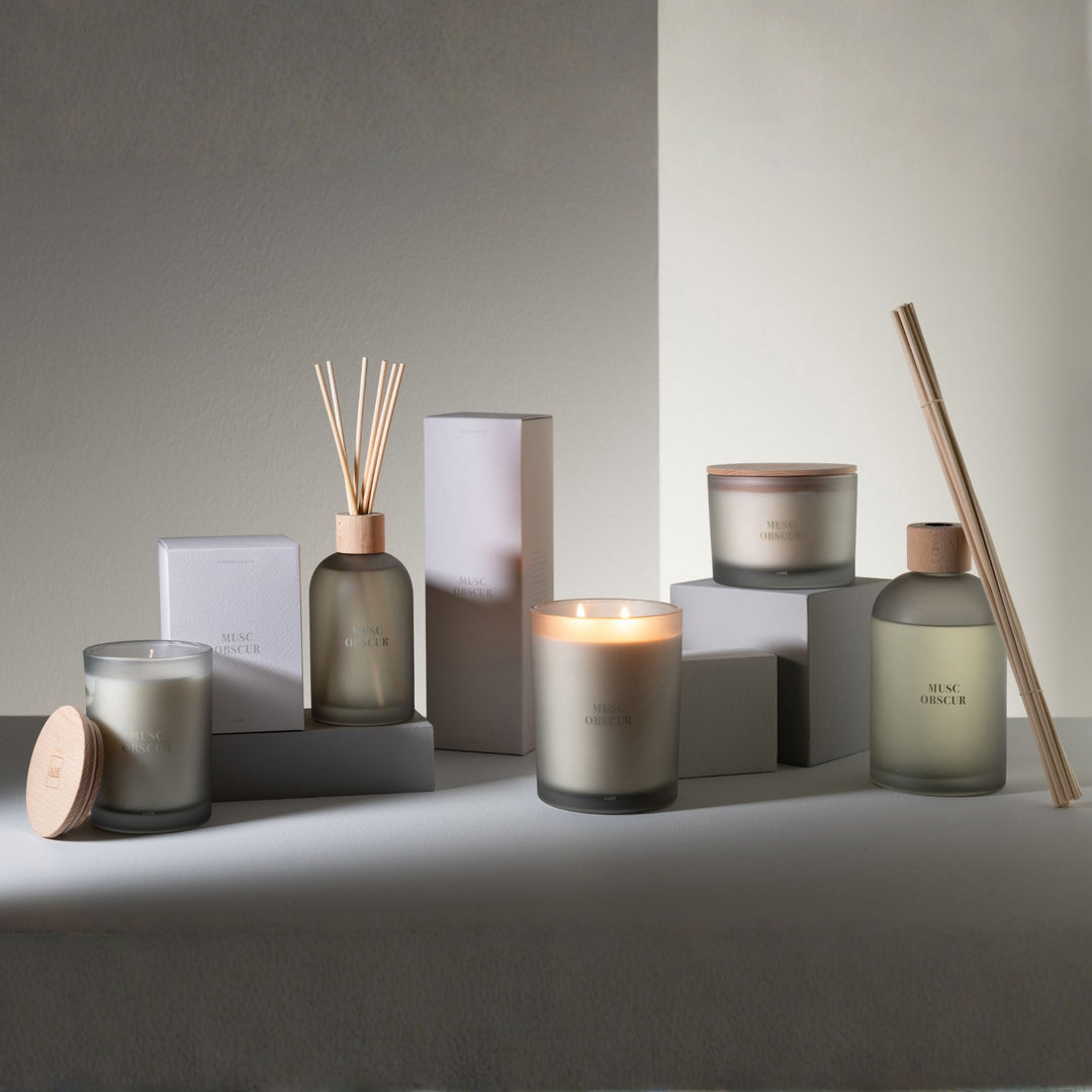 Full product lineup featuring the Musc diffuser with box, candle, and complementary items.