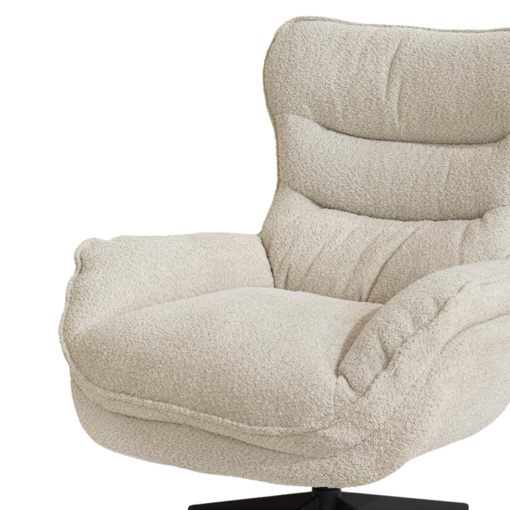 Close-up angled view showing the plush fabric and cushioned design of the Mysore Lounge Chair.