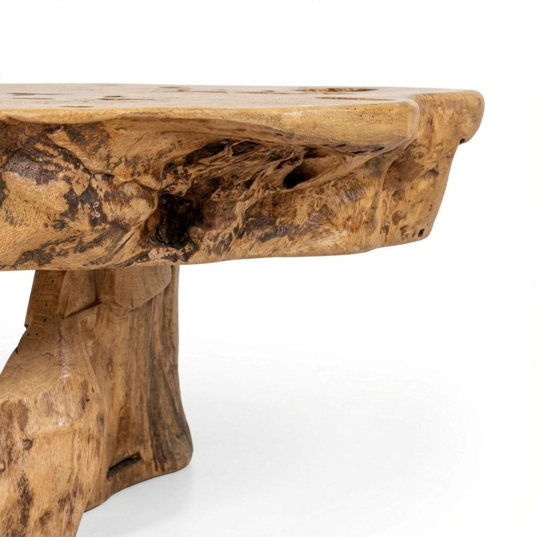 Side view of Nairobi Coffee Table highlighting its solid base and handcrafted structure.