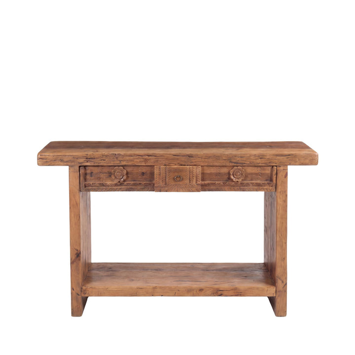 Front view of the Nairobi console showing its reclaimed wood structure and hand-carved drawer fronts.