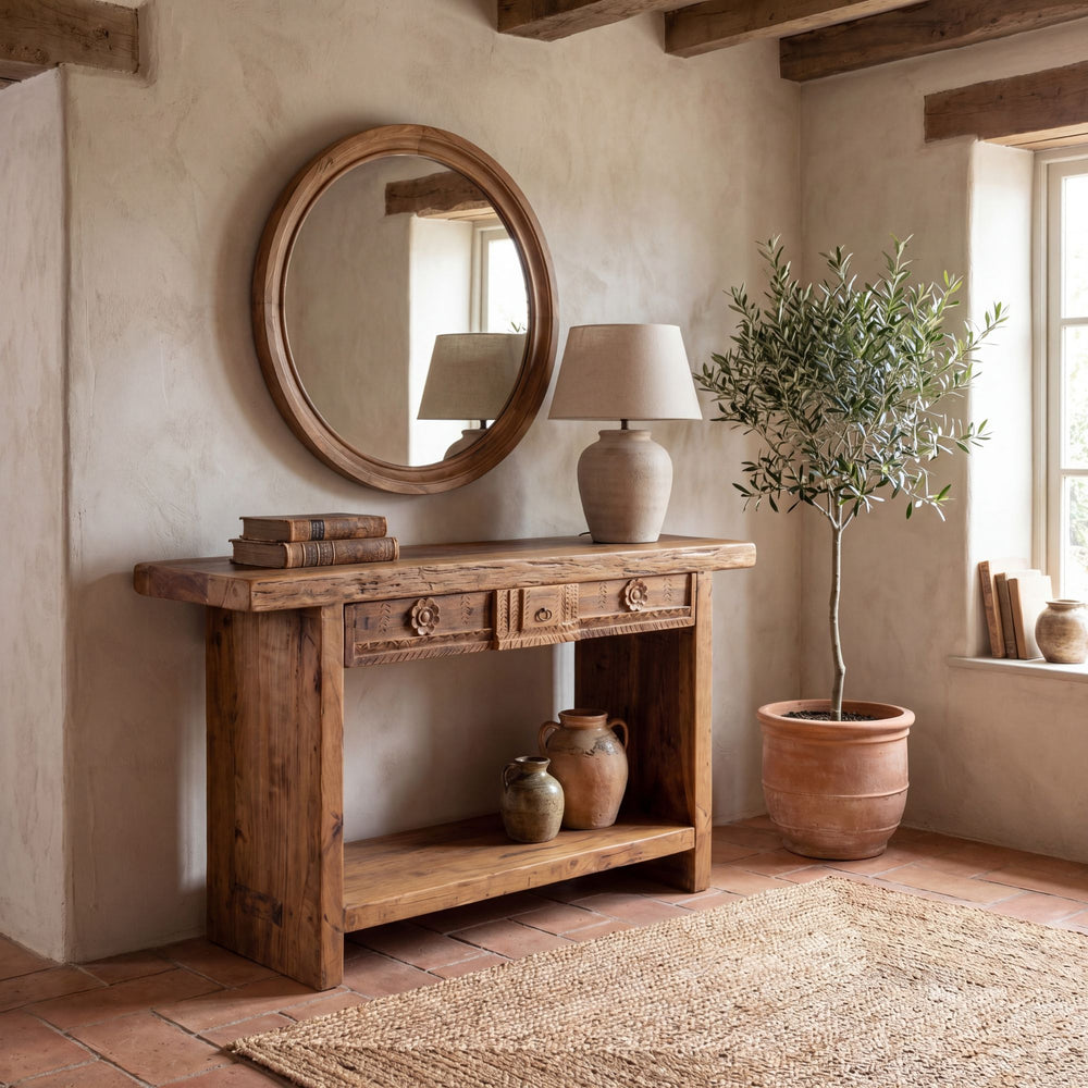 Styled interior setting featuring the Nairobi console beneath a round mirror in a warm natural space.