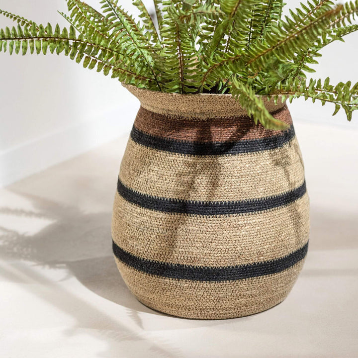 Nambia basket styled as a planter cover with greenery