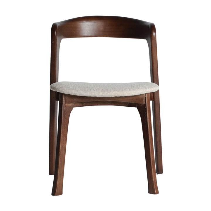 Front view of Nara Dining Chair showing curved backrest and compact profile.