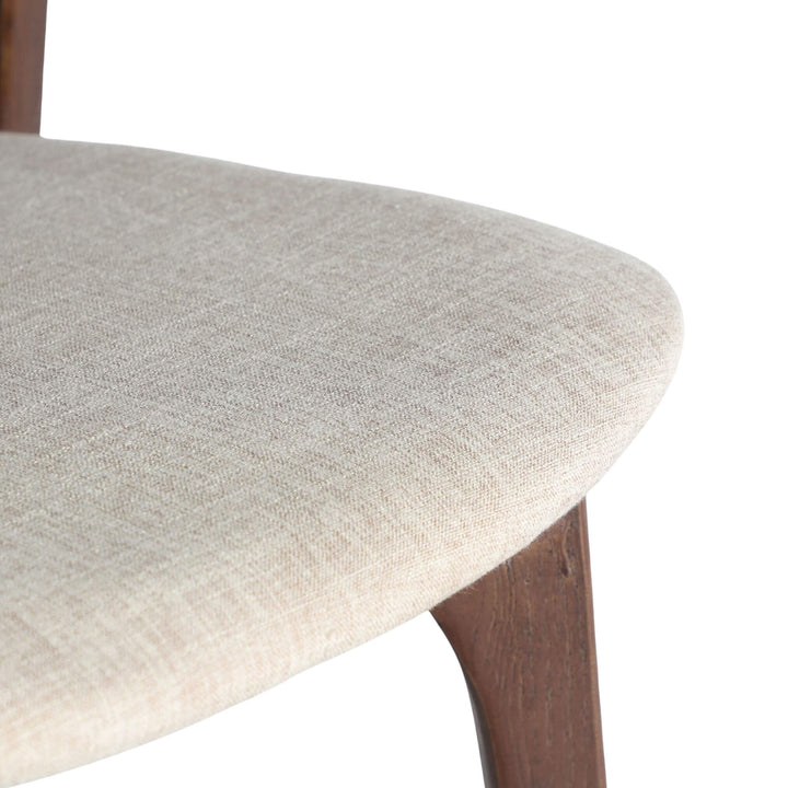 Close-up of smooth elm backrest joint on Nara Dining Chair.