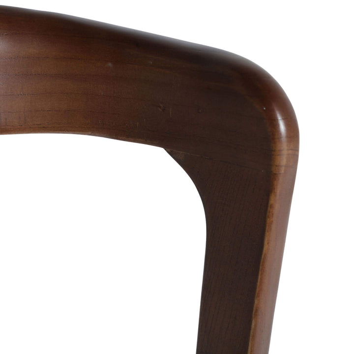 Detail of beige linen seat and elm corner joinery.