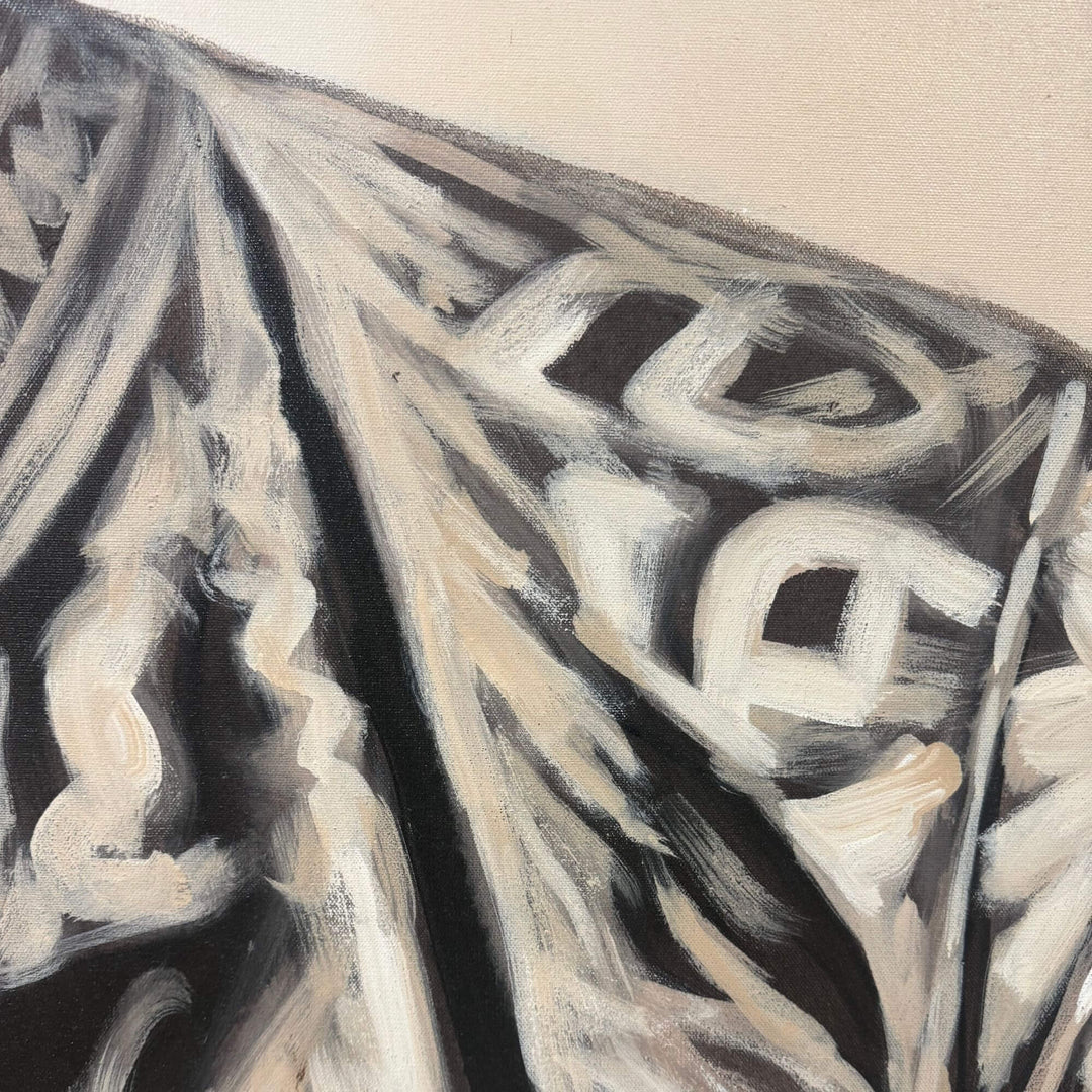 Close-up detail of the abstract black and white geometric brushwork on the Ndebele Canvas.