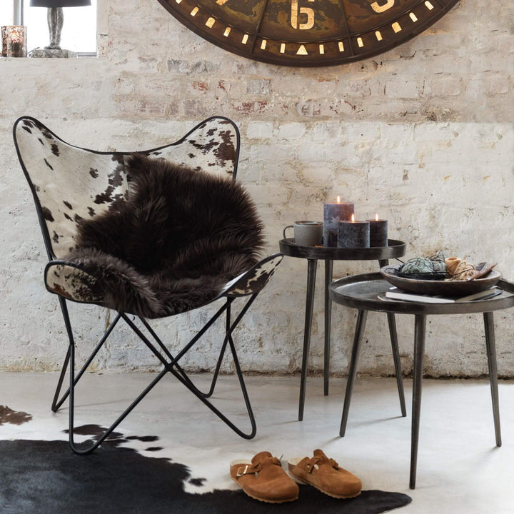 Styled interior scene with Neo coffee table holding candles