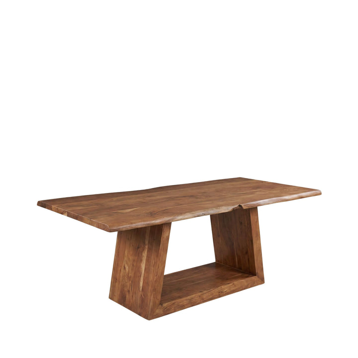 Front view of the Neru acacia dining table showing its sculptural base and solid wood top.