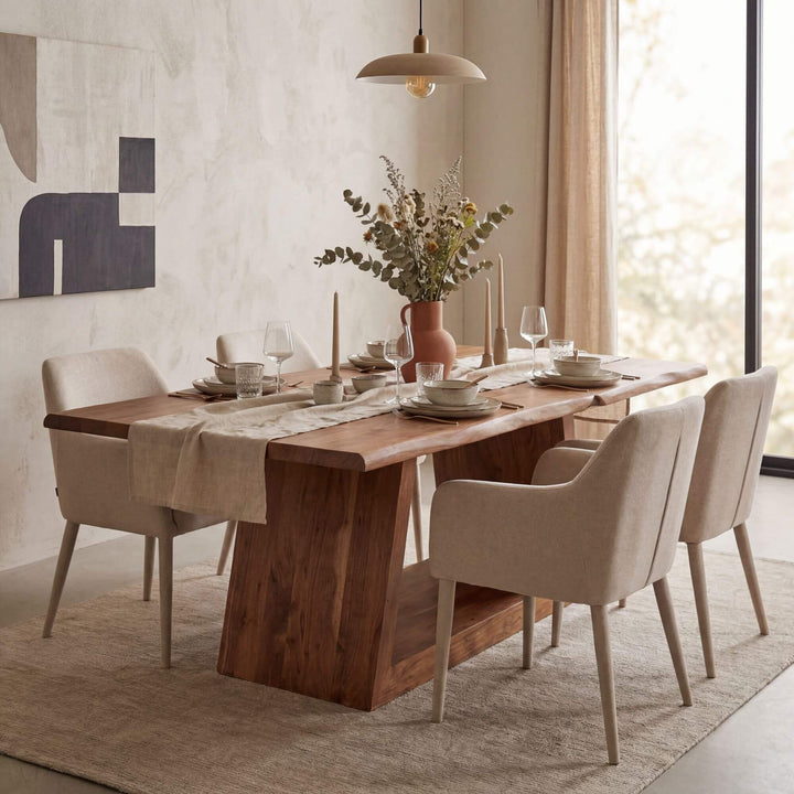 Styled dining room setting featuring the Neru table in a warm contemporary interior.