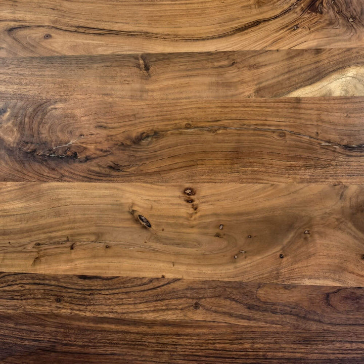Close-up of the acacia wood surface showing the rich grain and natural tone variation.