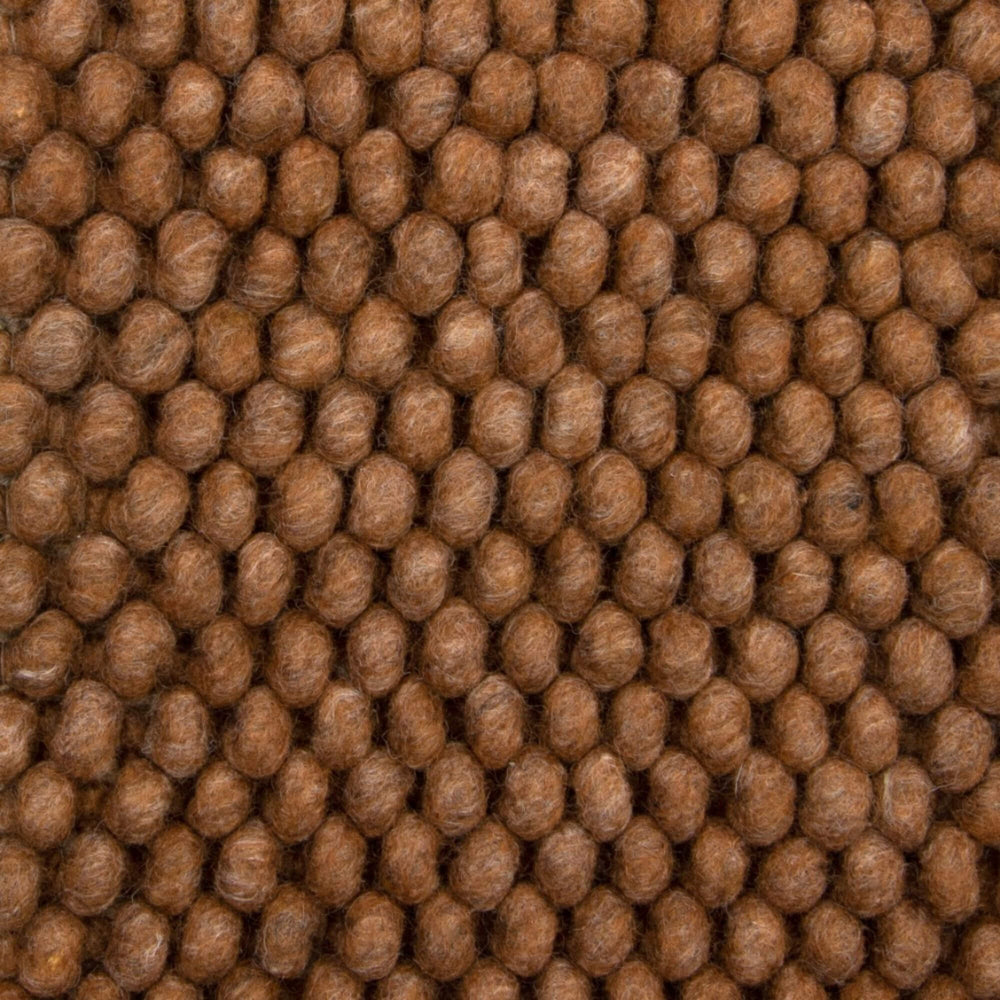 Close-up of the wool–viscose looped weave showing depth and natural fiber detail.