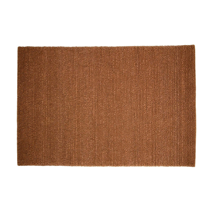 Front view of the New Loop Rug in warm earthy tone with looped texture.