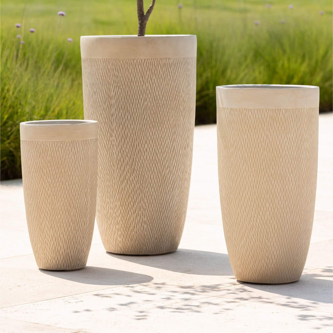 Outdoor scene with New Ceramic Pots displayed with plants.