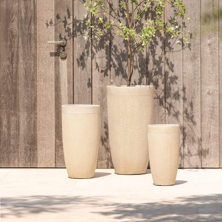 Trio of New Ceramic Pots arranged on a terrace.