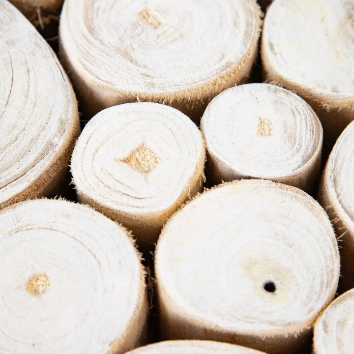 Close-up detail of natural teak branches showing grain, texture, and organic variations.
