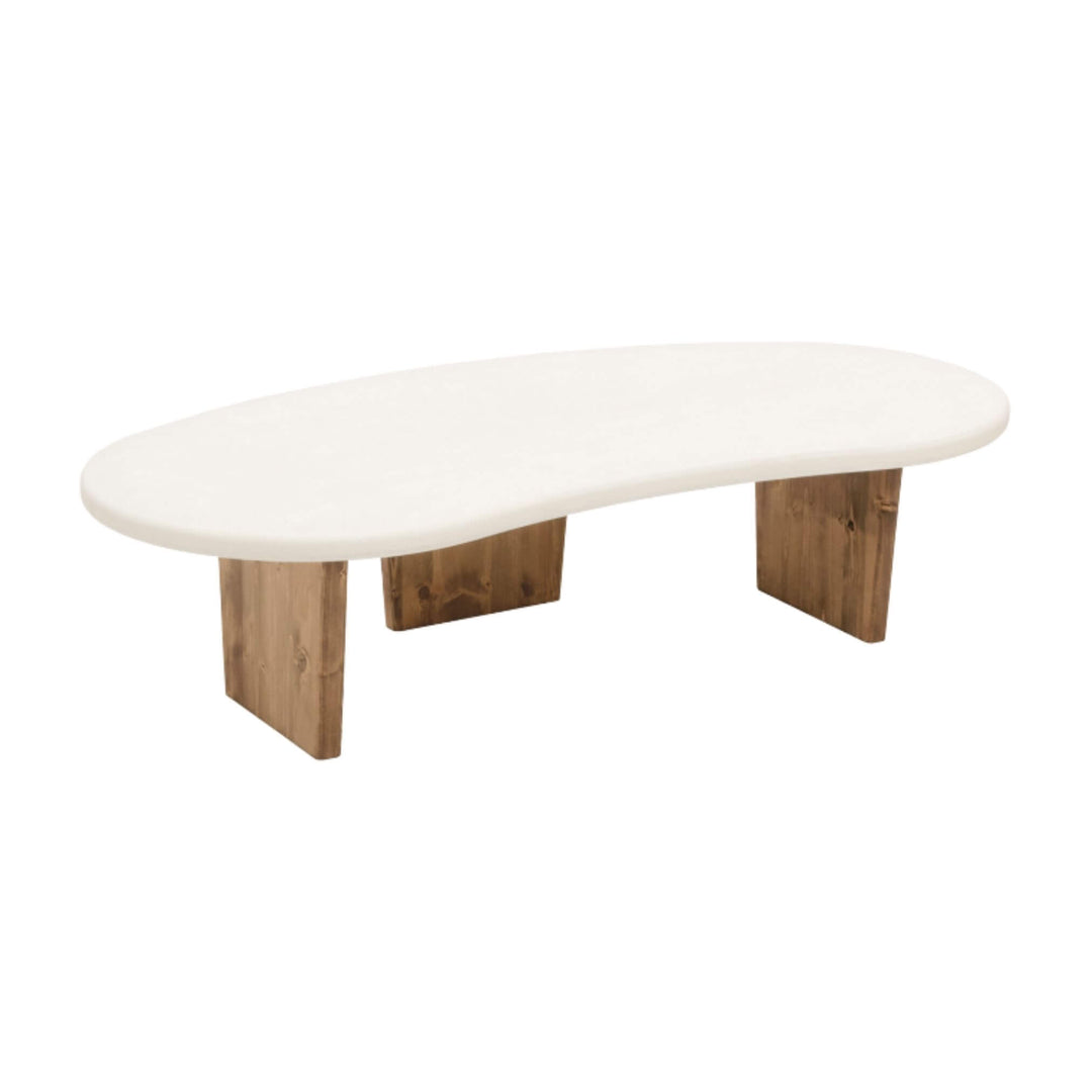 Front view of Nila microcement organic coffee table with curved top and pine legs