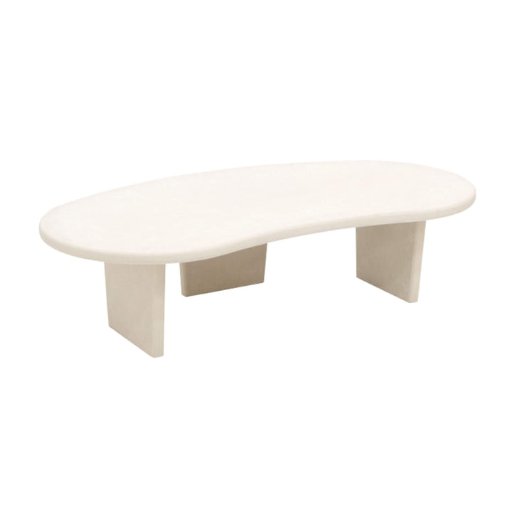 Front view of Nila microcement organic coffee table with curved top and legs