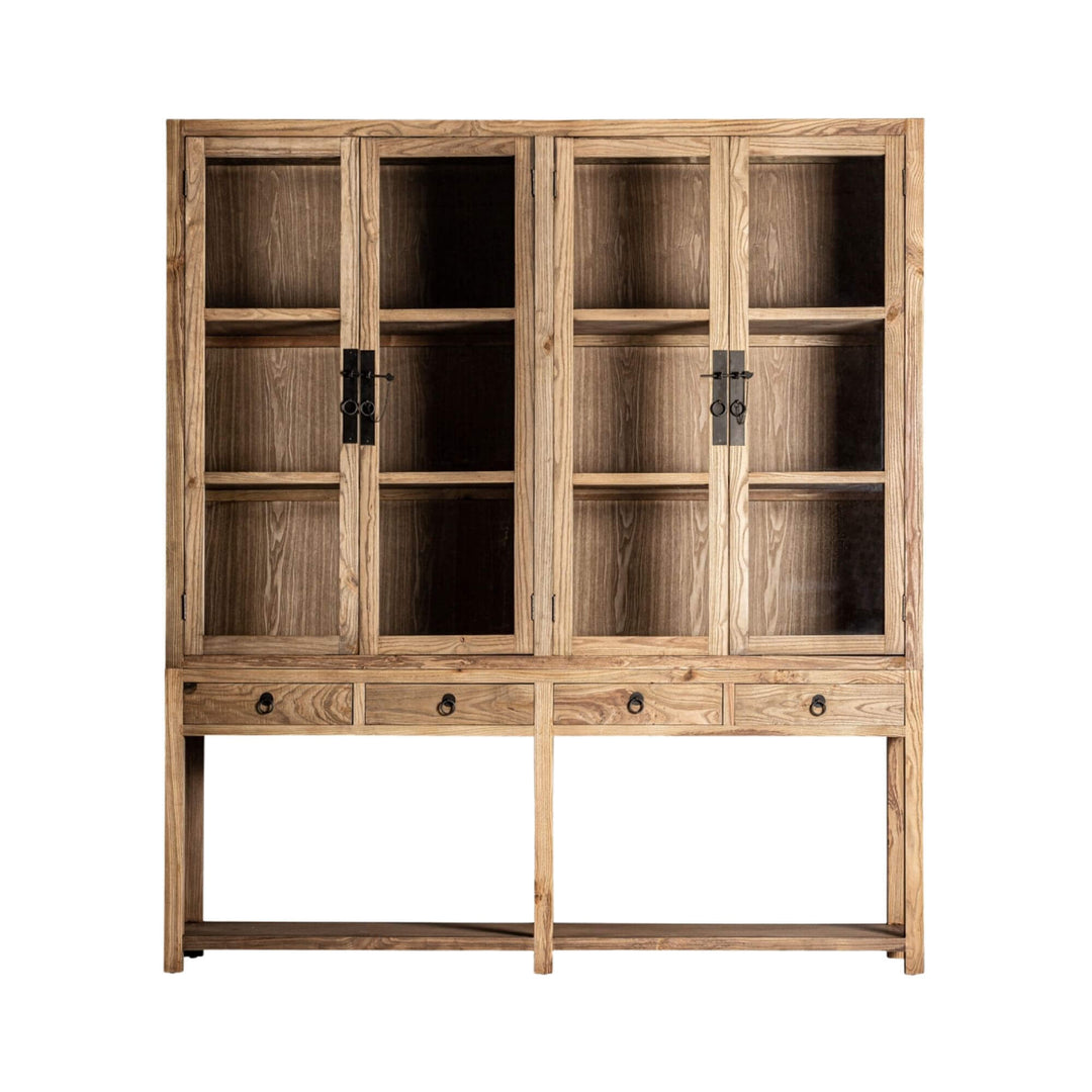 Front view of the Nilo Cabinet crafted from natural elm wood with glass doors.