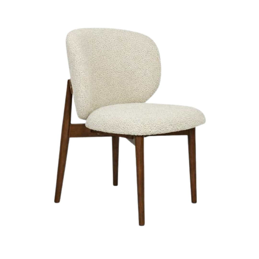 Front view of the Nolan dining chair showing its curved chenille seat and oak wood frame.