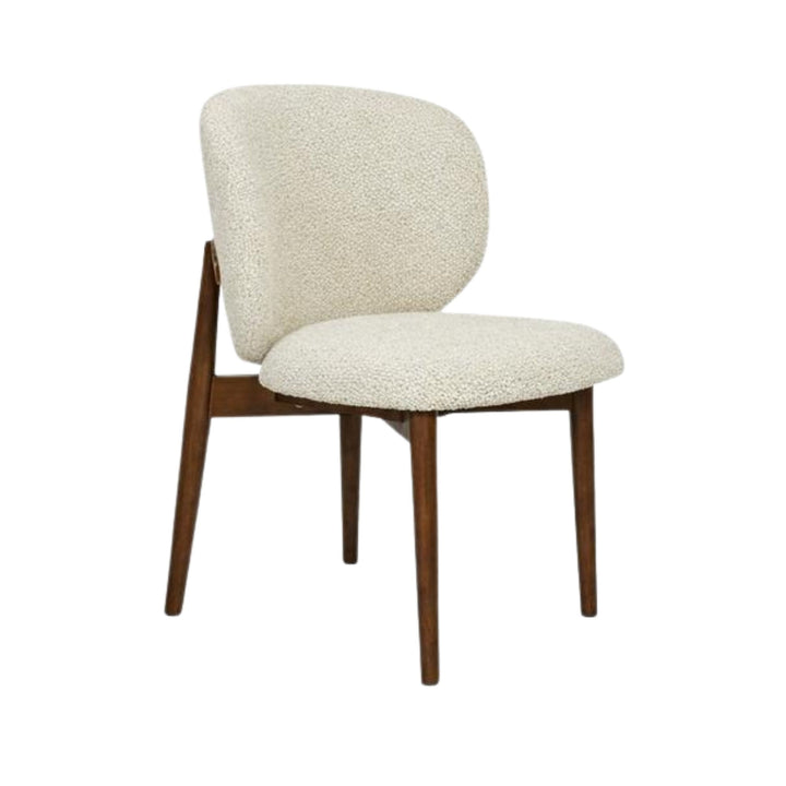 Front view of the Nolan dining chair showing its curved chenille seat and oak wood frame.