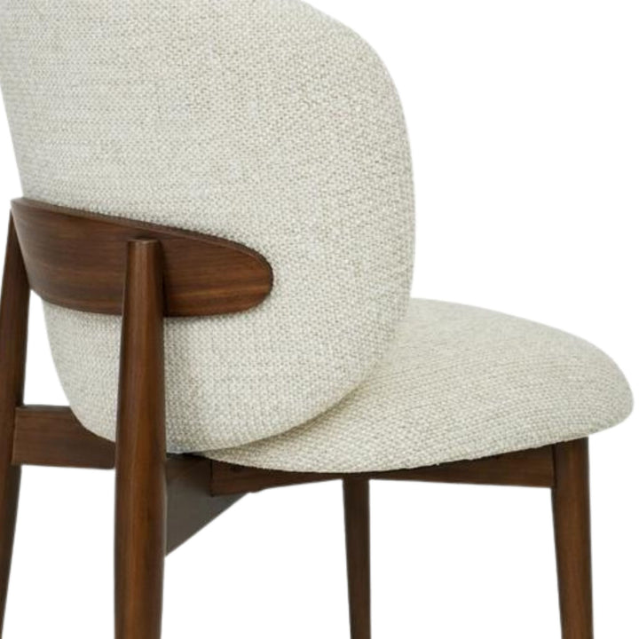 Close-up detail of the chenille upholstery and curved back support.