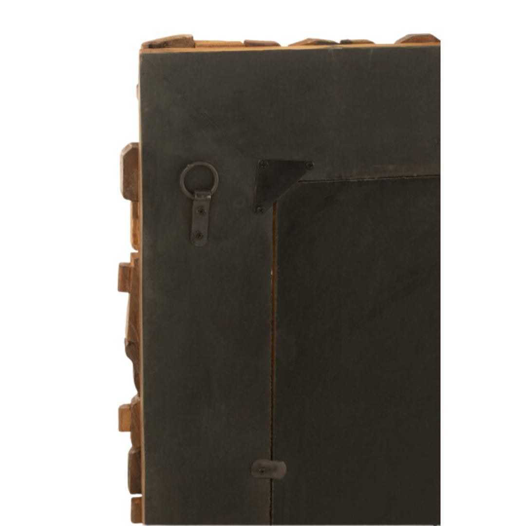 Close-up of Nommo Mirror showing handcrafted wooden texture.

