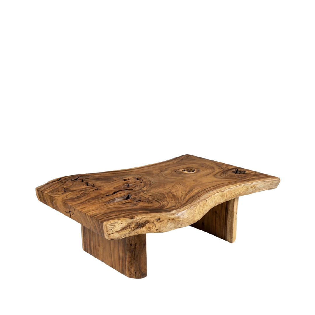 Angled view of Noonu Coffee Table made from solid suar wood with an organic live-edge silhouette.