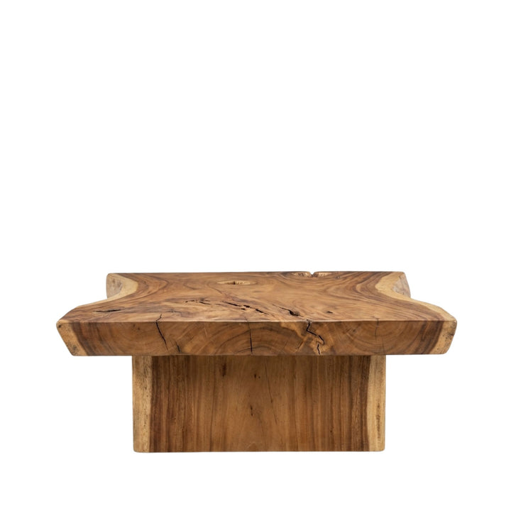 Side view of Noonu Coffee Table showing the solid wooden base and handcrafted construction.