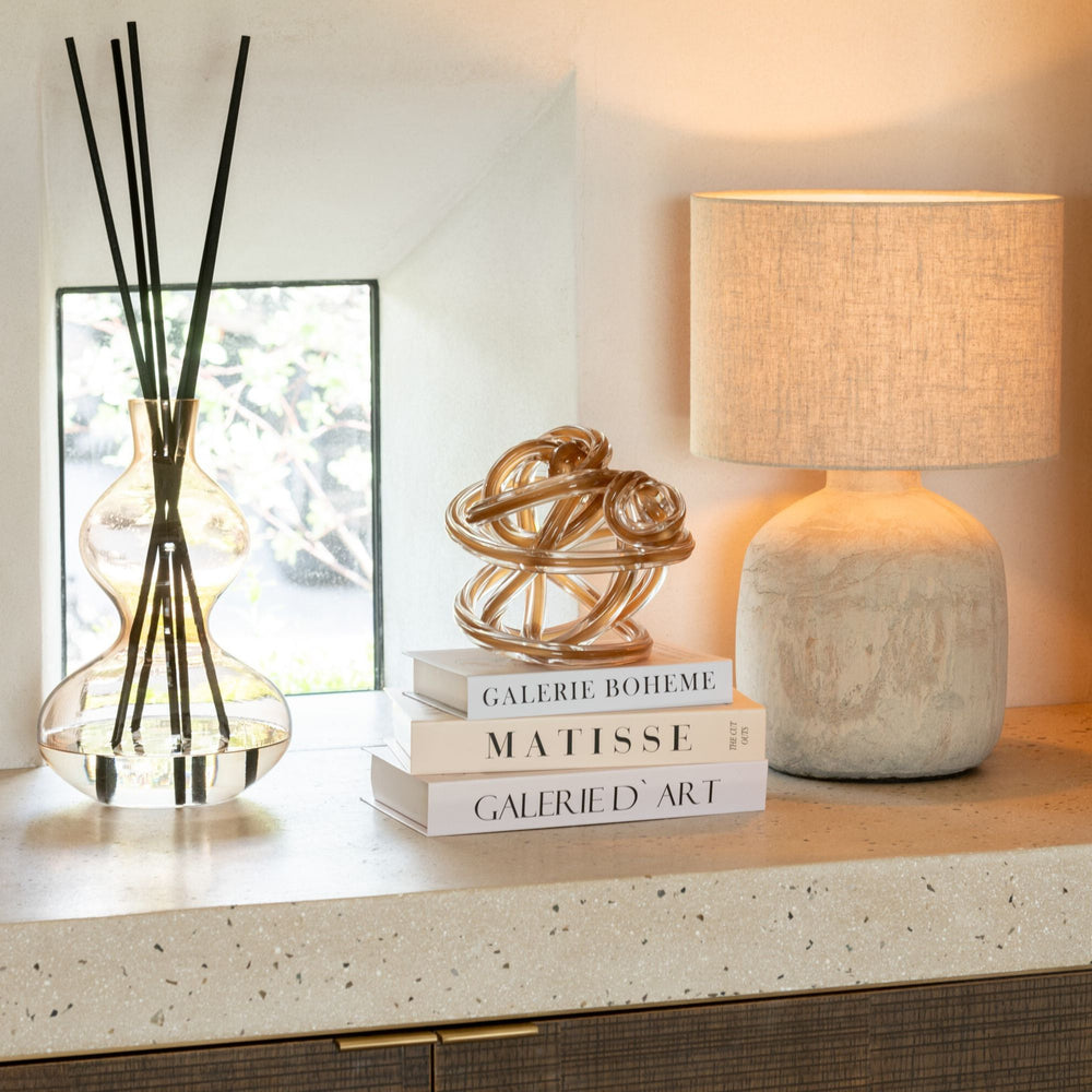 Nordic Vetiver Diffuser displayed on a console table within a warm, modern interior.