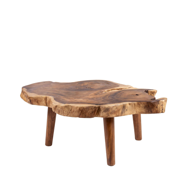 Front angled view of the Nuku Hiva suar wood coffee table with an organic free-form top and solid wooden legs