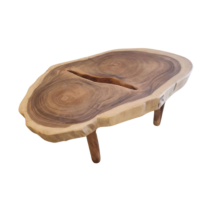 Angled view of the Nuku Hiva Coffee Table showing its rich suar wood grain and handcrafted surface.
