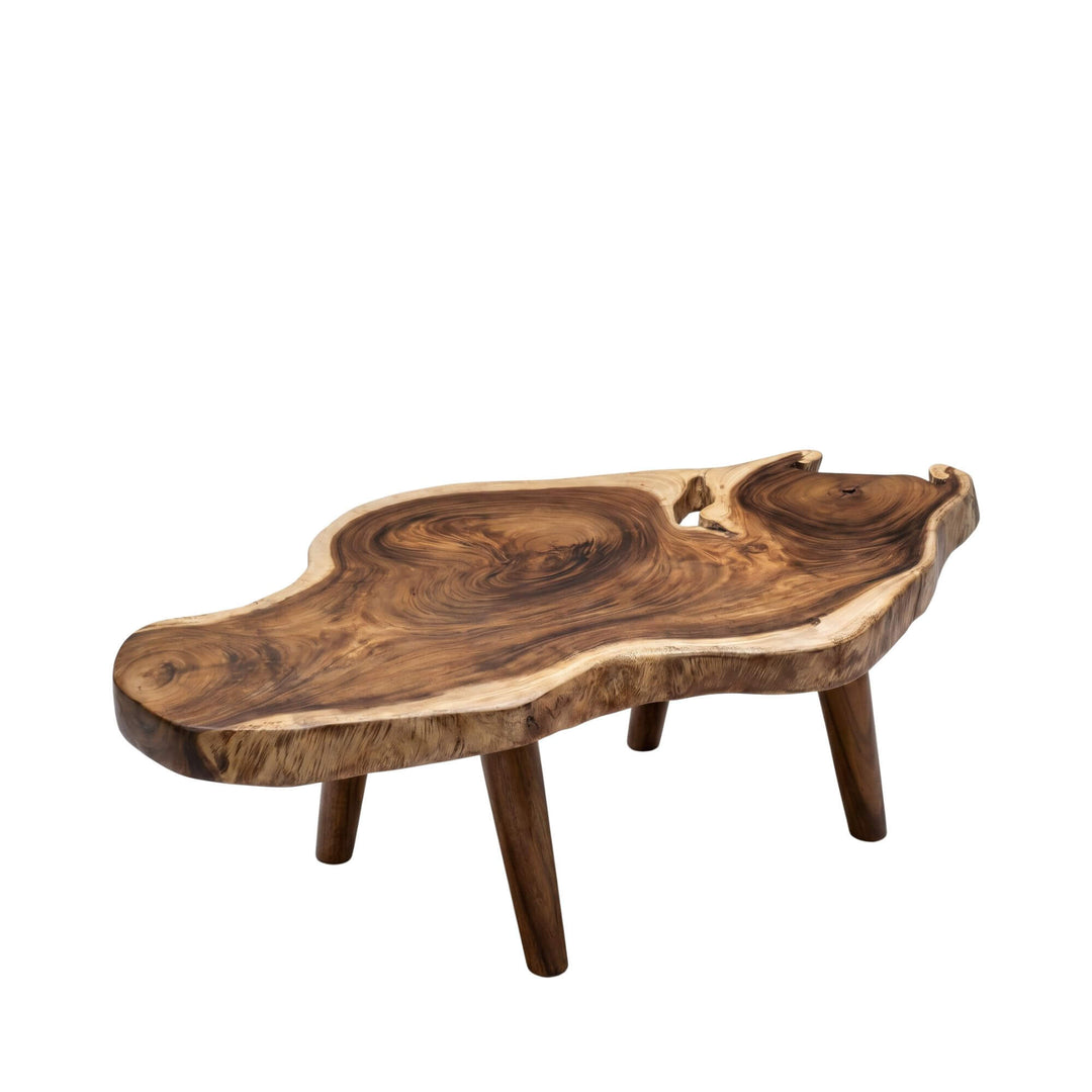 Front view of the Nuku Hiva suar wood coffee table showing its organic solid wood shape and natural edges.