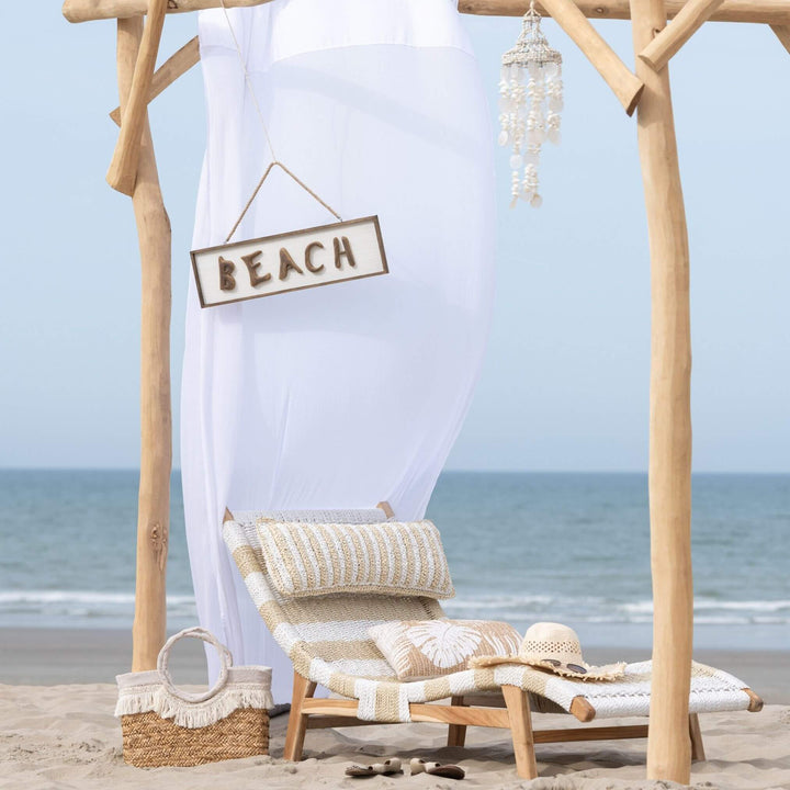 Lifestyle image of Nungwi sunbed on a beach setting with canopy