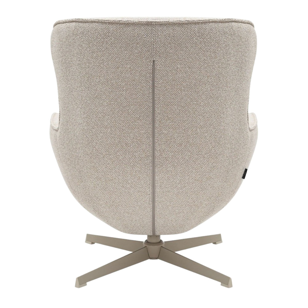 Rear view of the Nuba Lounge Chair displaying the smooth fabric and metal swivel base.